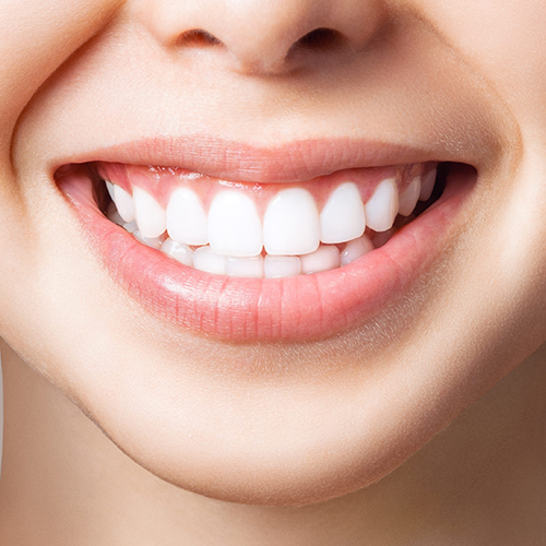 Smiling person showing white teeth